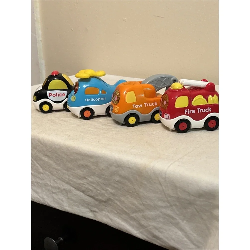 VTech Go! Go! Smart Wheels Lot of 4 Police Fire Tow Helicopter Toys